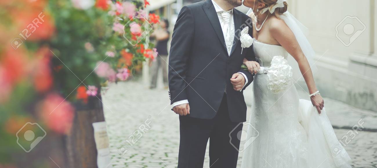 Newlywed Couple Holding Hands Spending Happy Wedding Day Together