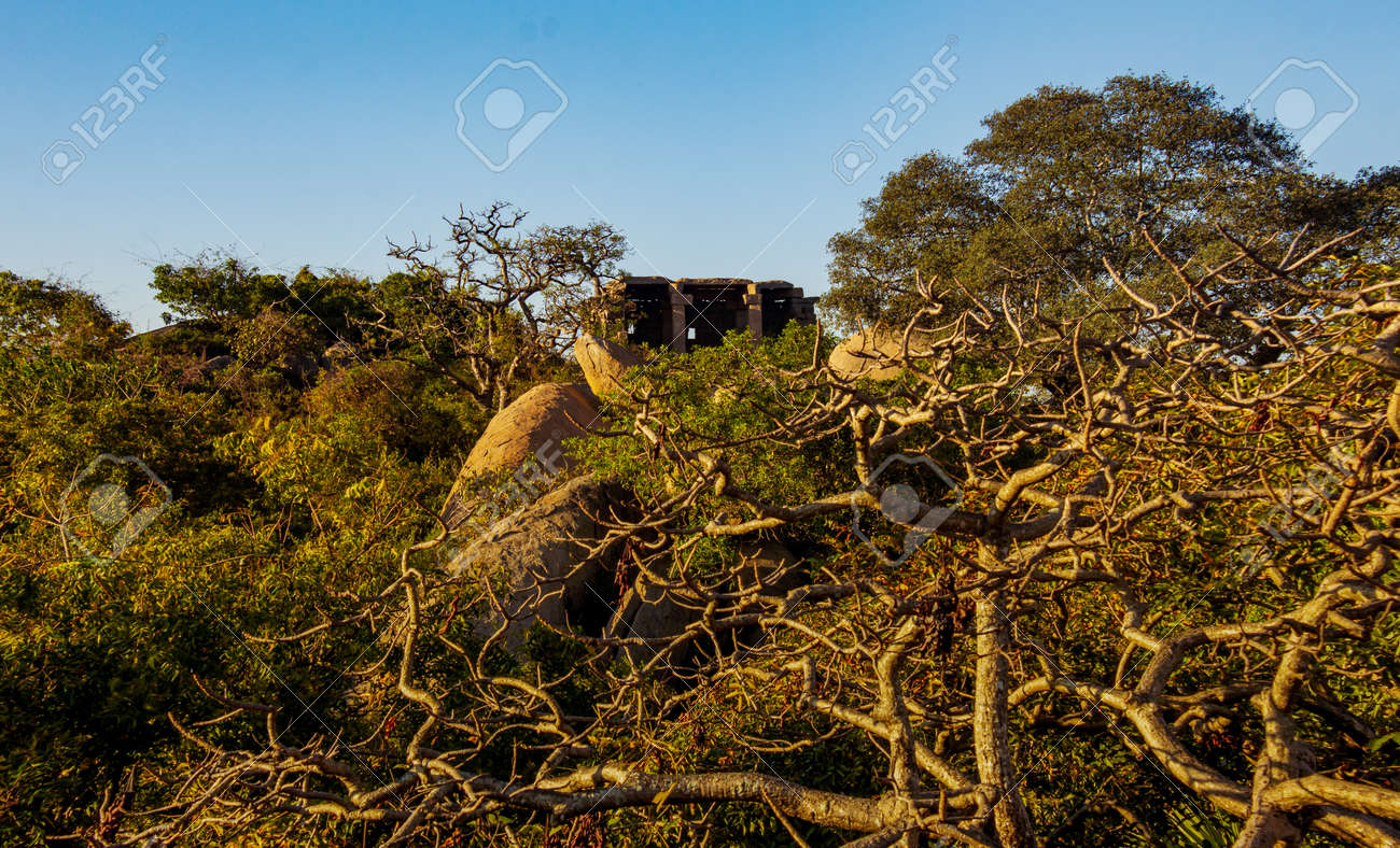 View of an old shed made out of rocks in the old port city, Mahabalipuram, Tamil Nadu, India. Focus set on the rocks and shed - 165825610 View of an old shed made out of rocks in the old port city, Mahabalipuram, Tamil Nadu, India. Focus set on the rocks and shed - 165825610
