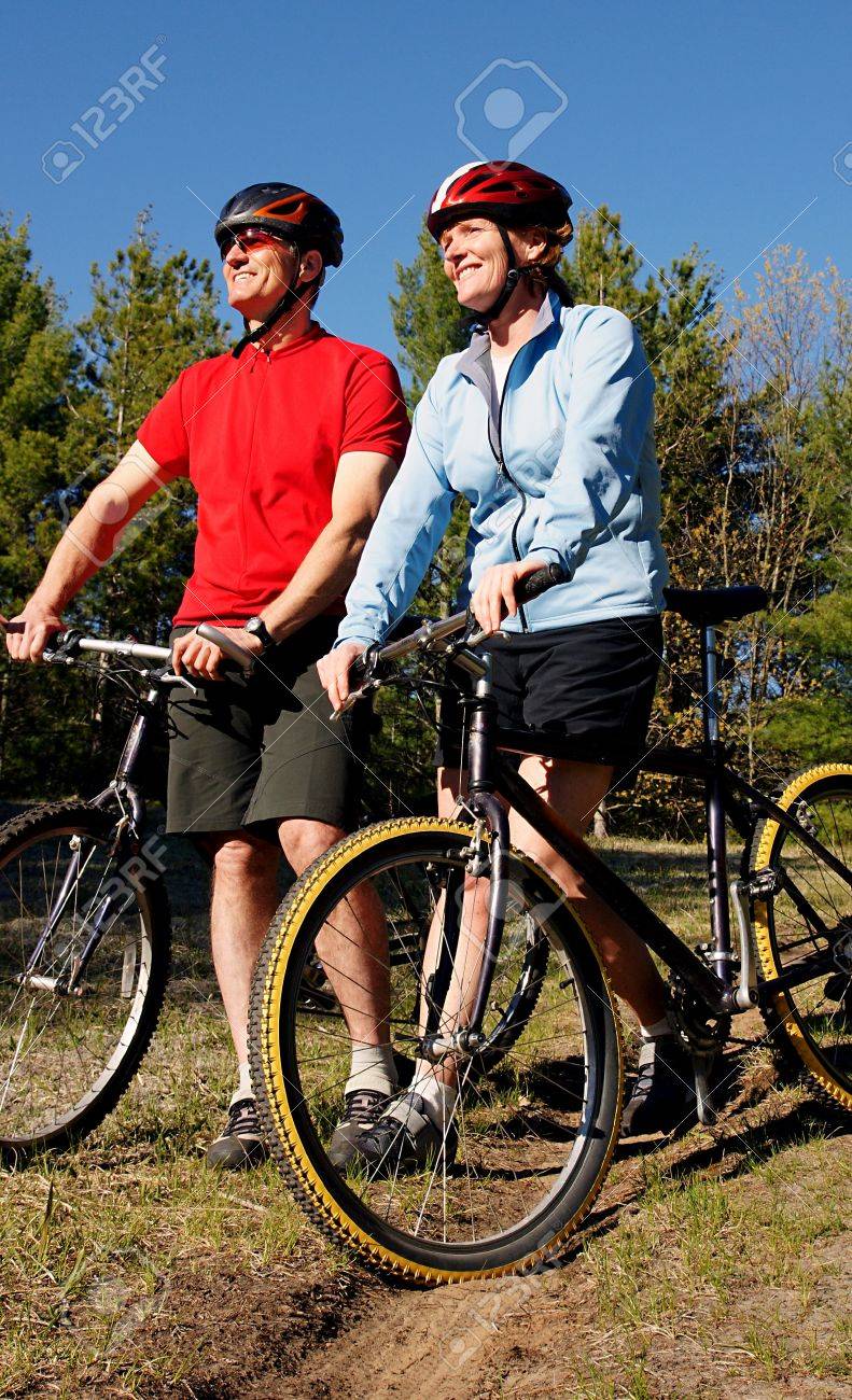 Mountain biking boomers soak in late afternoon sunlight in Wasaga Beach, Ontario. - 3088178 Mountain biking boomers soak in late afternoon sunlight in Wasaga Beach, Ontario. - 3088178