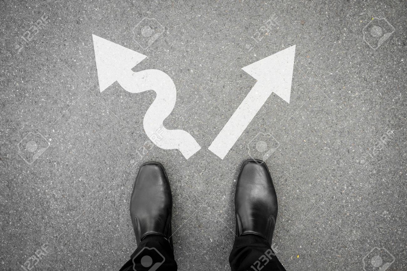 Black shoes standing at the crossroad and has to make decision which way to go for his success - hard way or easy way - 52383146 Black shoes standing at the crossroad and has to make decision which way to go for his success - hard way or easy way - 52383146