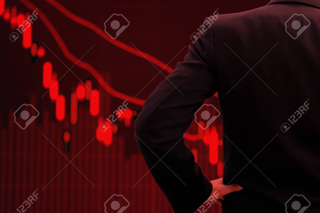 World Economy And Business In Crisis Concept Red Tone Businessman Watching Stock Market Collapse Stock Photo Picture And Royalty Free Image Image 143788997