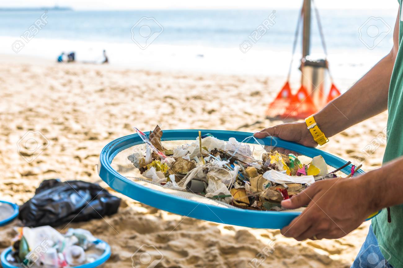 Beach Cleaning. Cleaning dirty beaches by the action of man. Sustainability of the planet and preservation of nature. - 100752120 Beach Cleaning. Cleaning dirty beaches by the action of man. Sustainability of the planet and preservation of nature. - 100752120