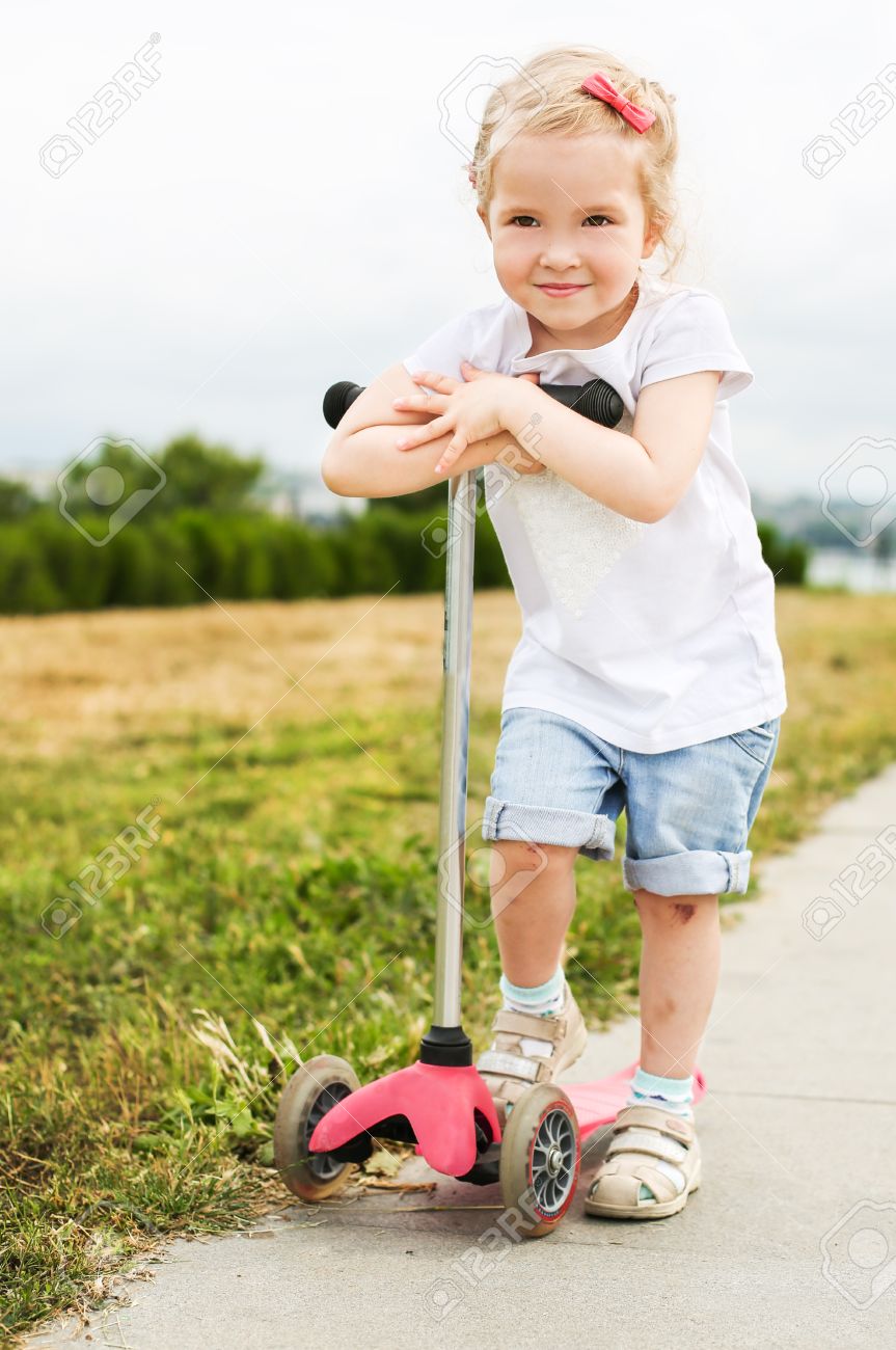 little girl on scooter