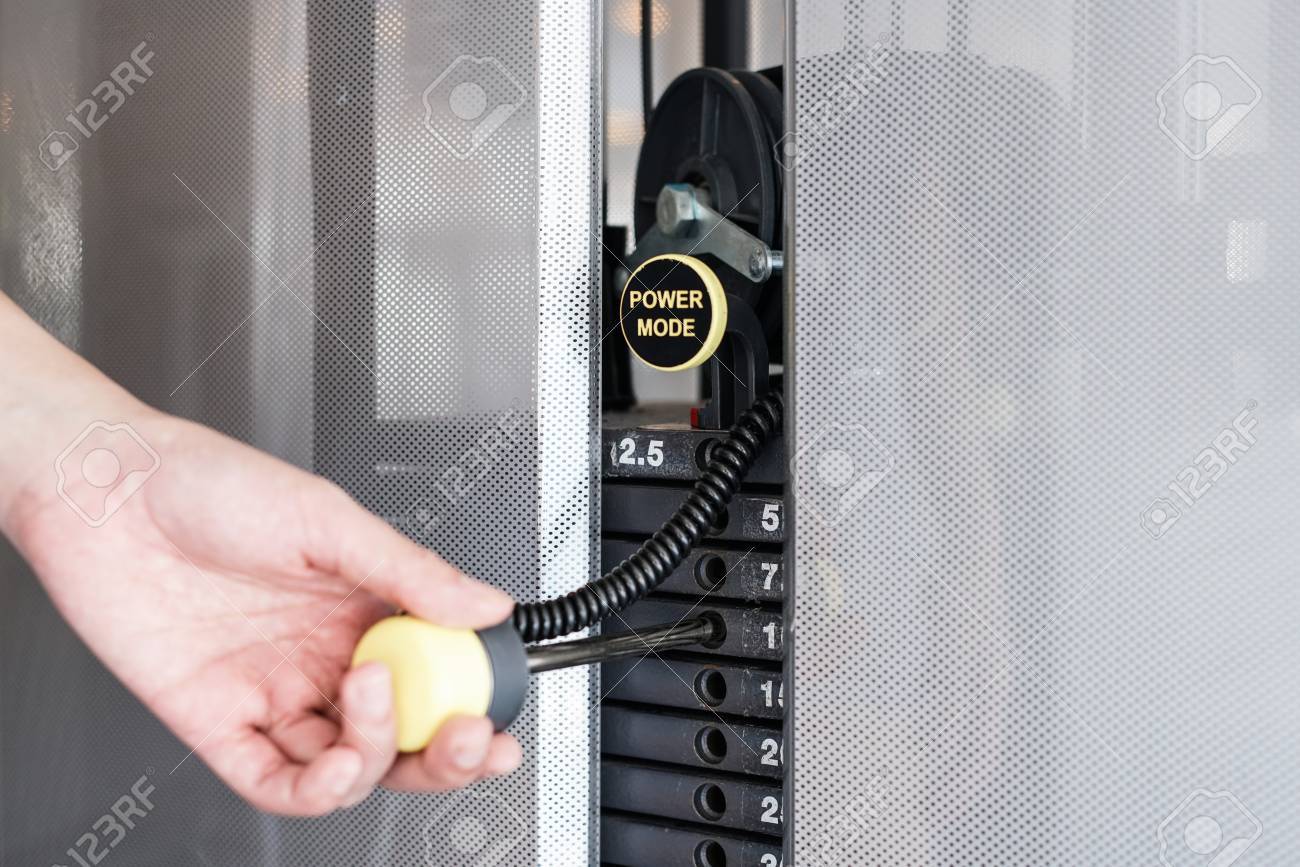 Hand Reduce Weight On Machine, Weight Stack Plates Change Selection.. Stock Photo, Picture And Royalty Free Image. Image 106058555.
