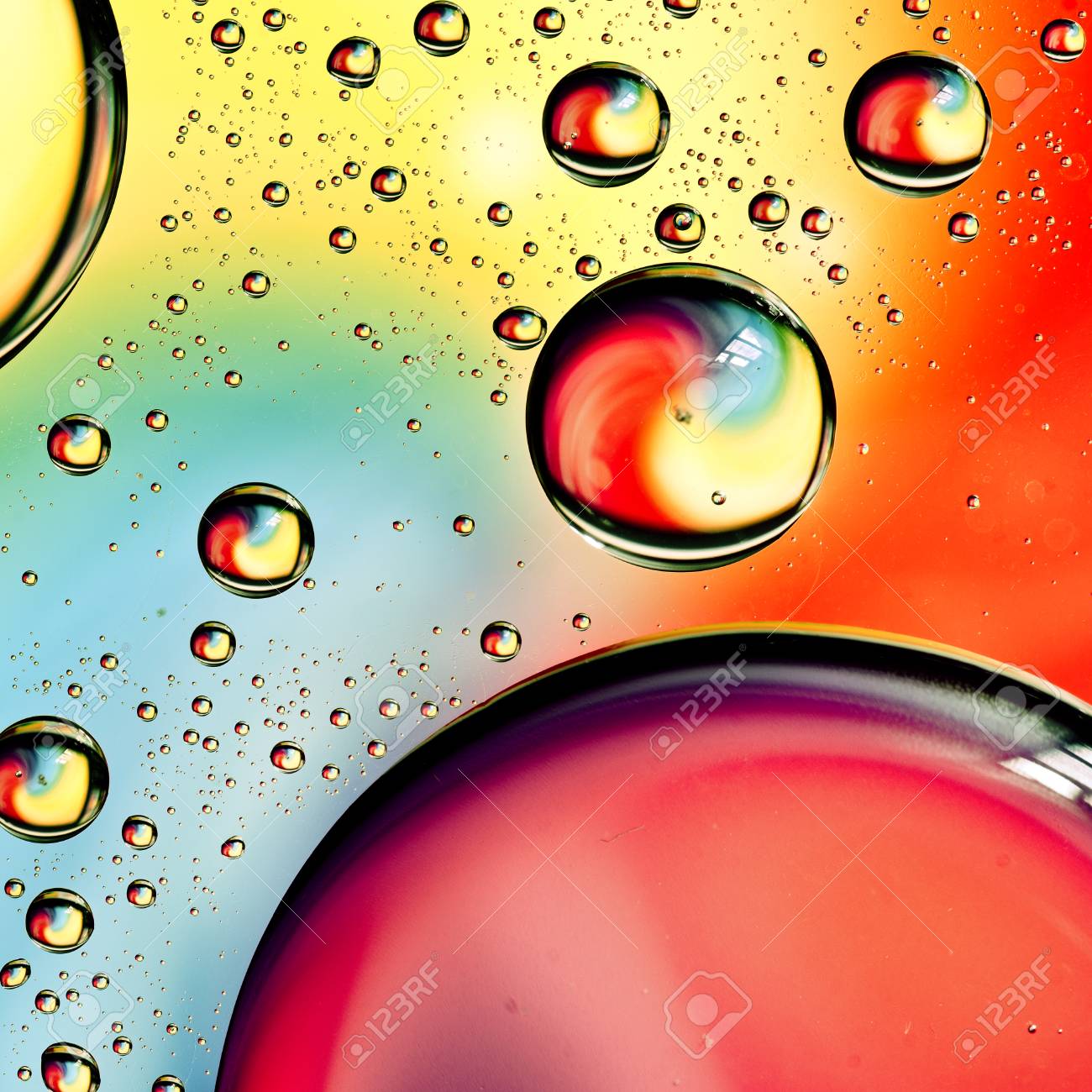 close up on water drops background on rainbow colors surface water droplets background