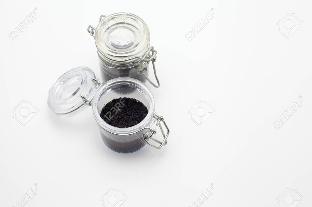 ecology concept little glass jar with soil stock photo picture and