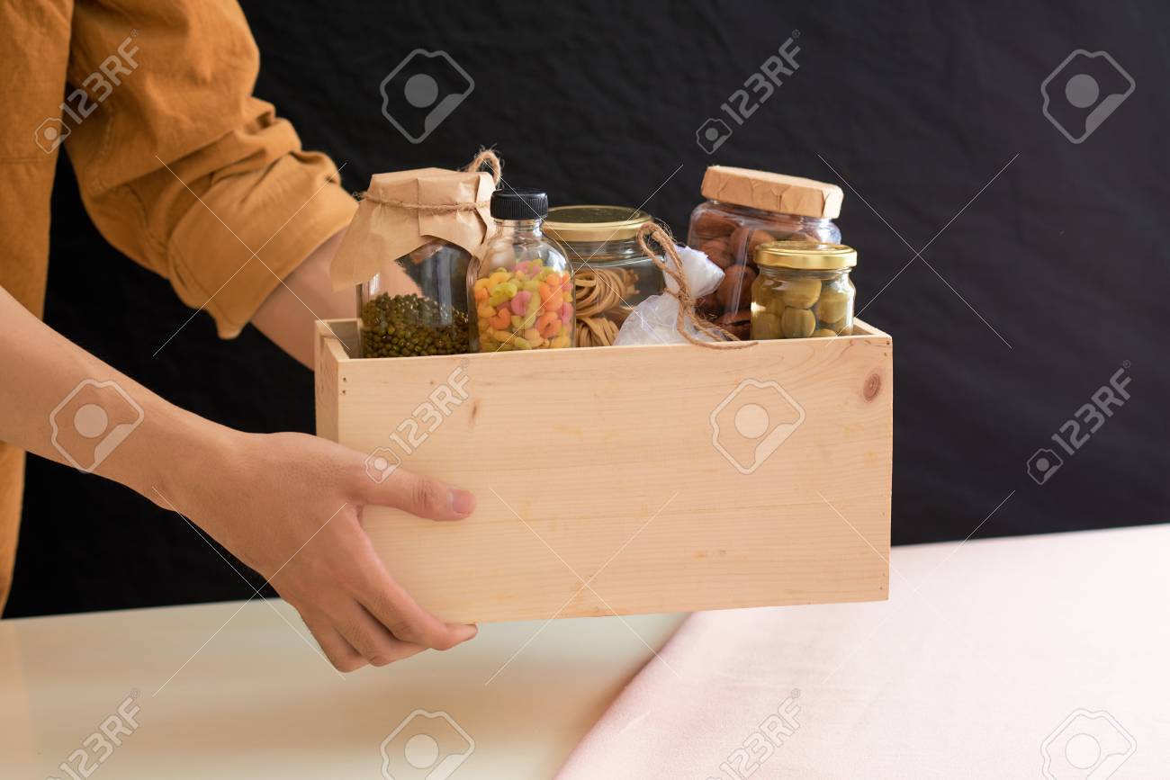 Volunteer with box of food for poor. Donation concept. - 96521094 Volunteer with box of food for poor. Donation concept. - 96521094