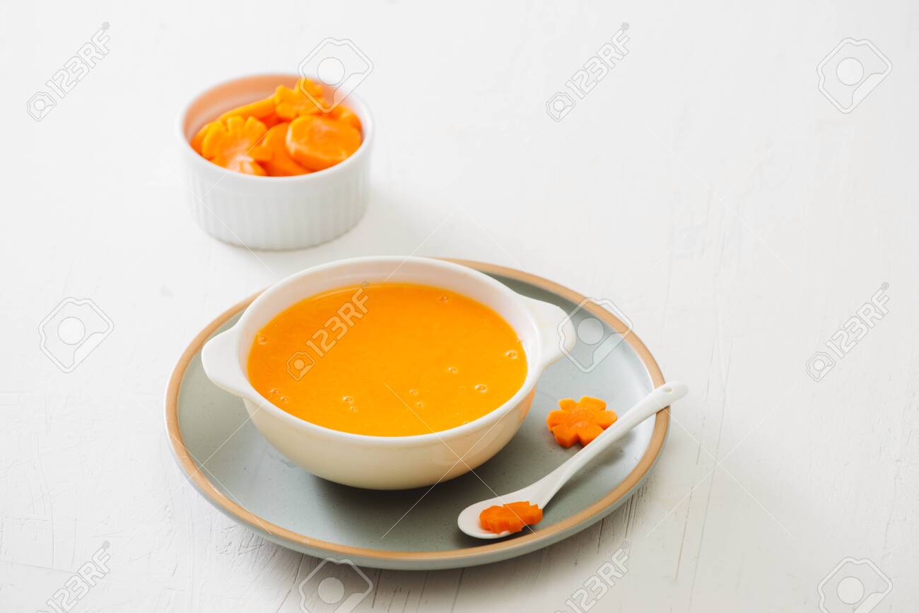 Carrot baby puree in bowl isolated on light background - 124343416 Carrot baby puree in bowl isolated on light background - 124343416