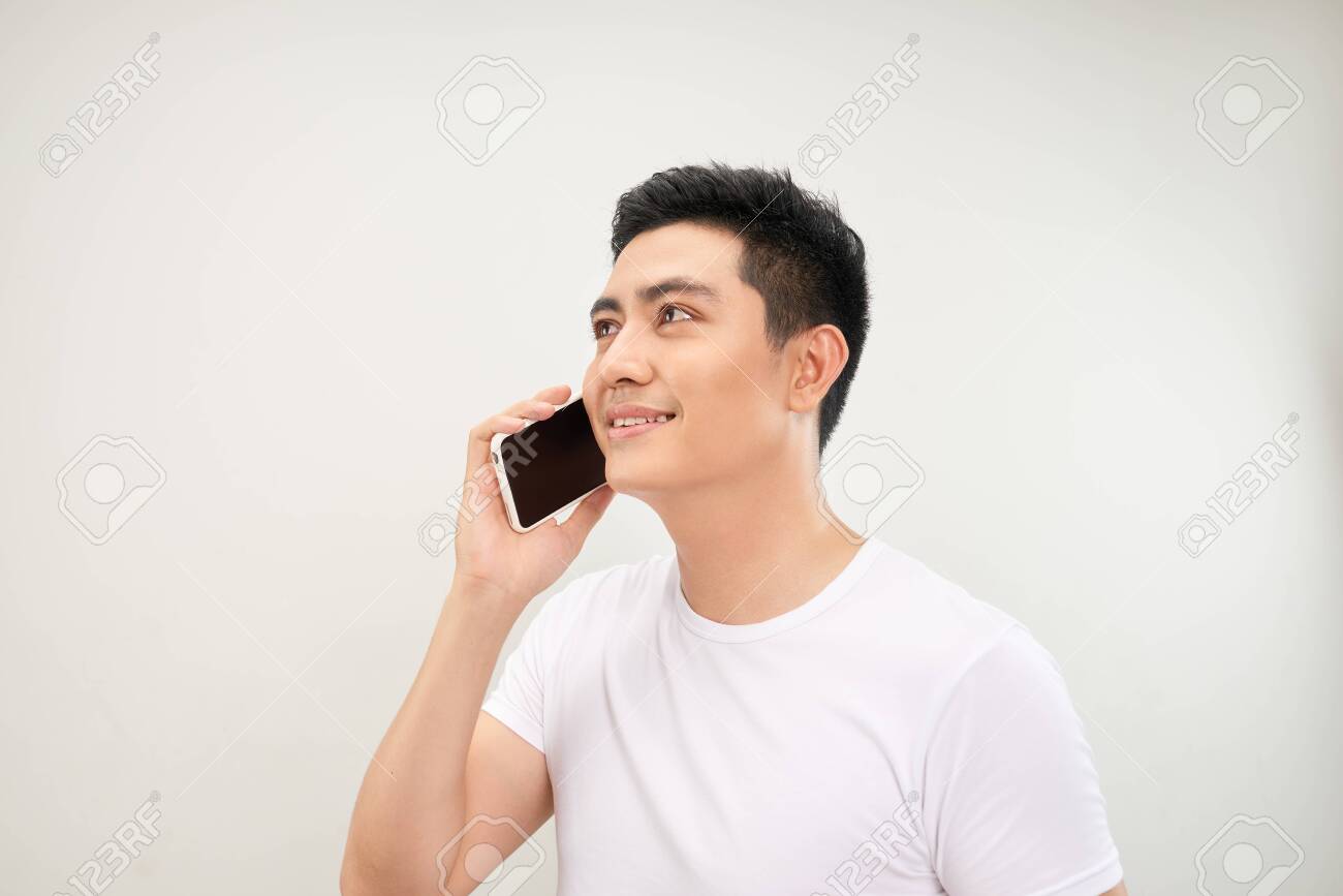 Young Man Talk To Mobile Phone Stock Photo, Picture and Royalty Free Image.  Image 127712390.