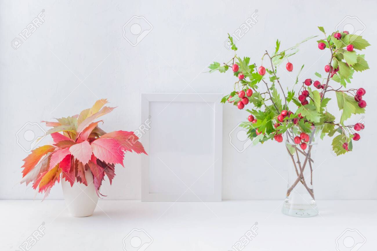 Mockup White Frame And Branches With Red Berries In A Vase On