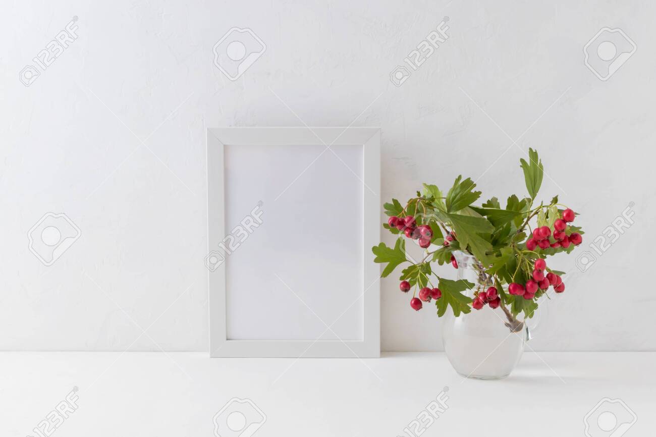 Mockup White Frame And Branches With Red Berries In A Vase On
