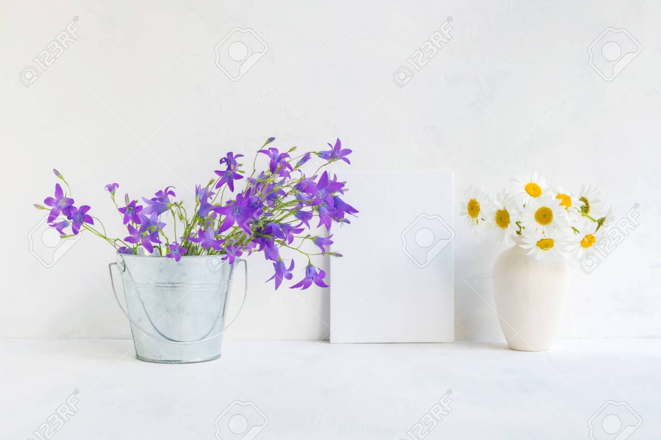 Download Mockup With A White Frame And Summer Flowers In A Metal Bucket Stock Photo Picture And Royalty Free Image Image 135547149 PSD Mockup Templates