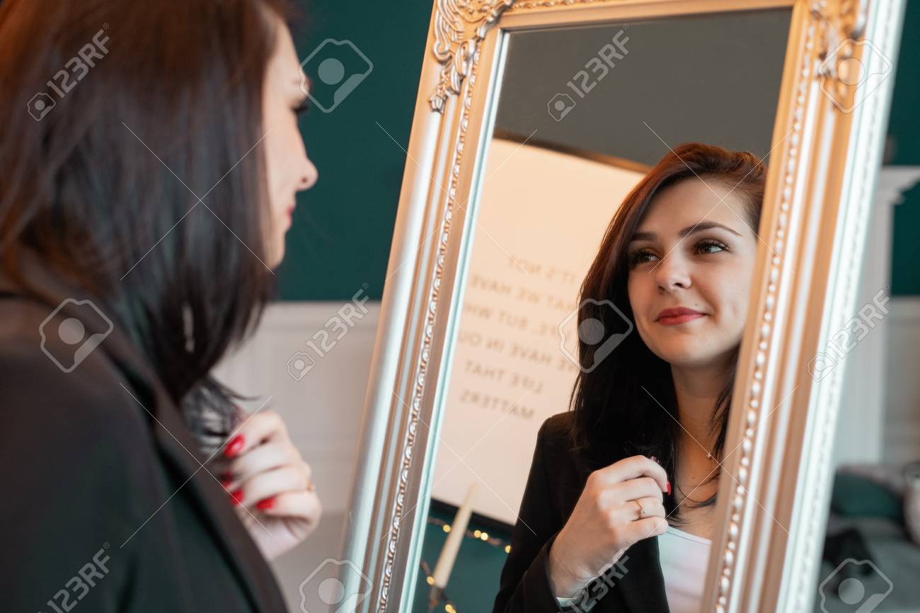 Young Woman Looking Herself Reflection In Mirror At Home Stock Photo,  Picture and Royalty Free Image. Image 115684462., image size:1300x866