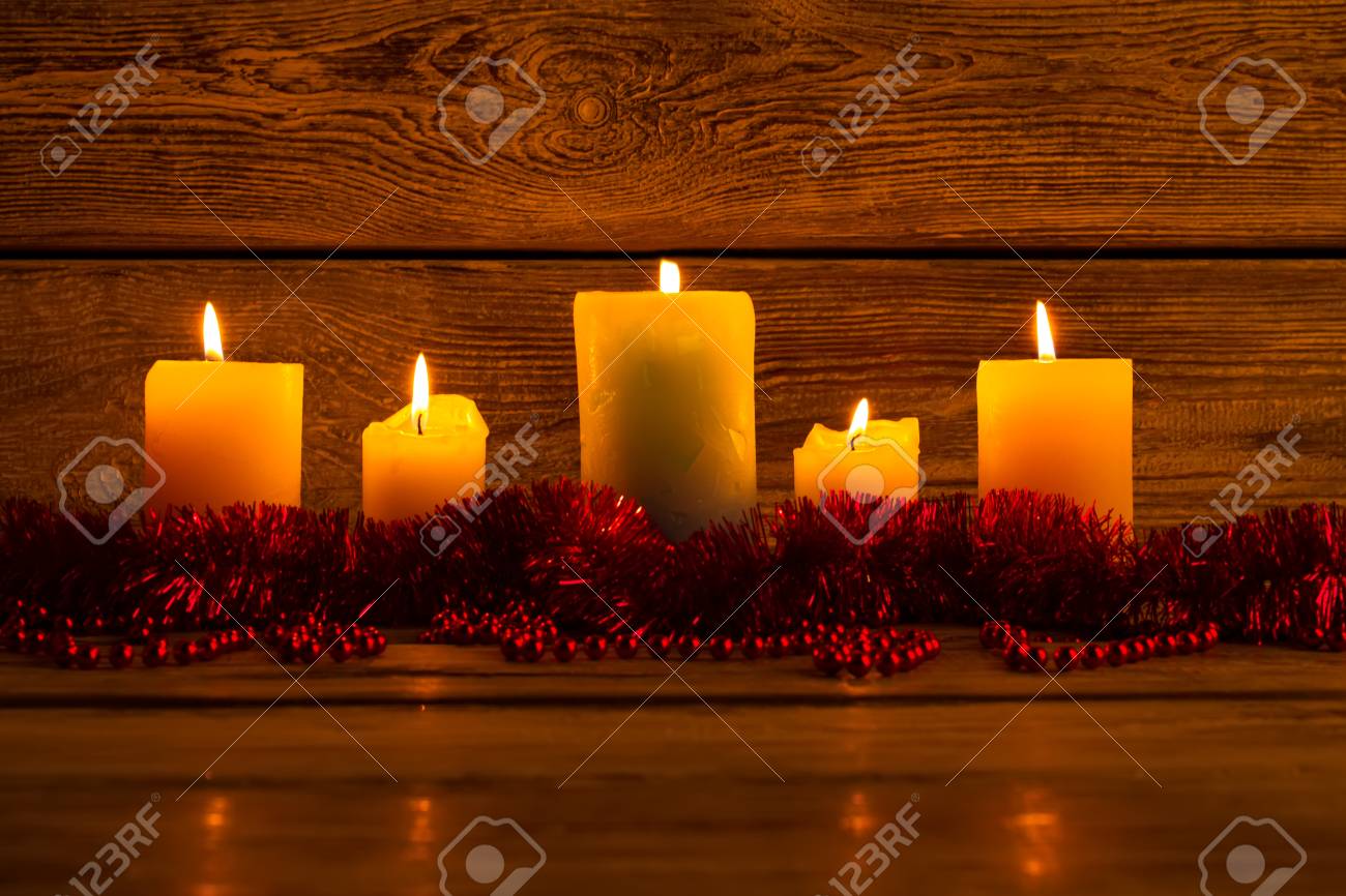 Lighted Candles And Red Garlands On Wooden Background Warm And Stock Photo Picture And Royalty Free Image Image 89253302