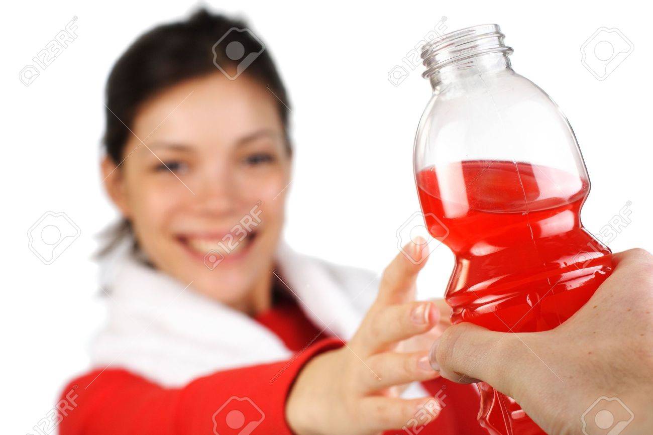 Fitness woman receiving an energy drink after workout. Isolated on white. - 4504697 Fitness woman receiving an energy drink after workout. Isolated on white. - 4504697
