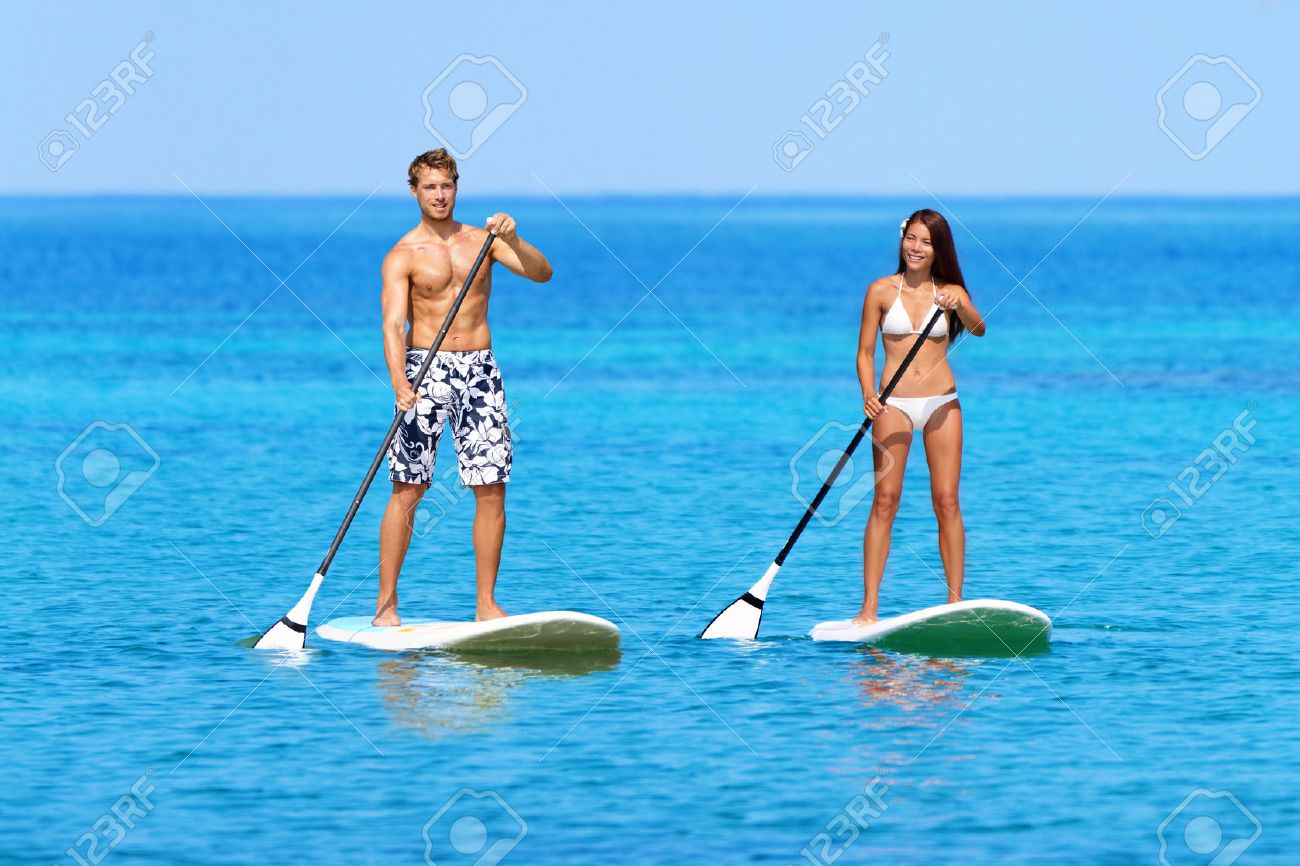 Stand Up Paddleboarding Beach People On Stand Up Paddle Board SUP