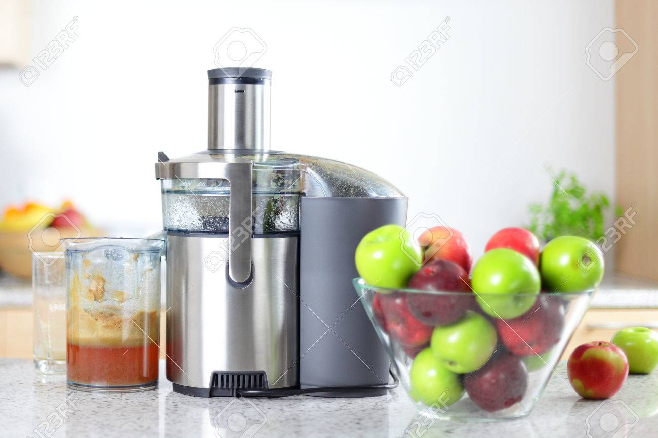 Apple Juice On Juicer Machine Juicing Concept Apples In Bowl Stock Photo Picture And Royalty Free Image Image 34979525