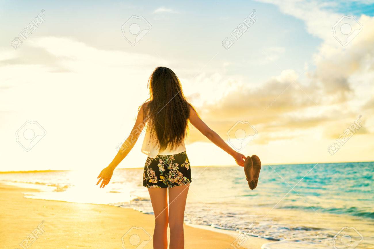Freedom woman carefree dancing relaxing on beach in sunset. Young people summer lifestyle vacation travel. Vitality healthy living concept. - 55651568 Freedom woman carefree dancing relaxing on beach in sunset. Young people summer lifestyle vacation travel. Vitality healthy living concept. - 55651568