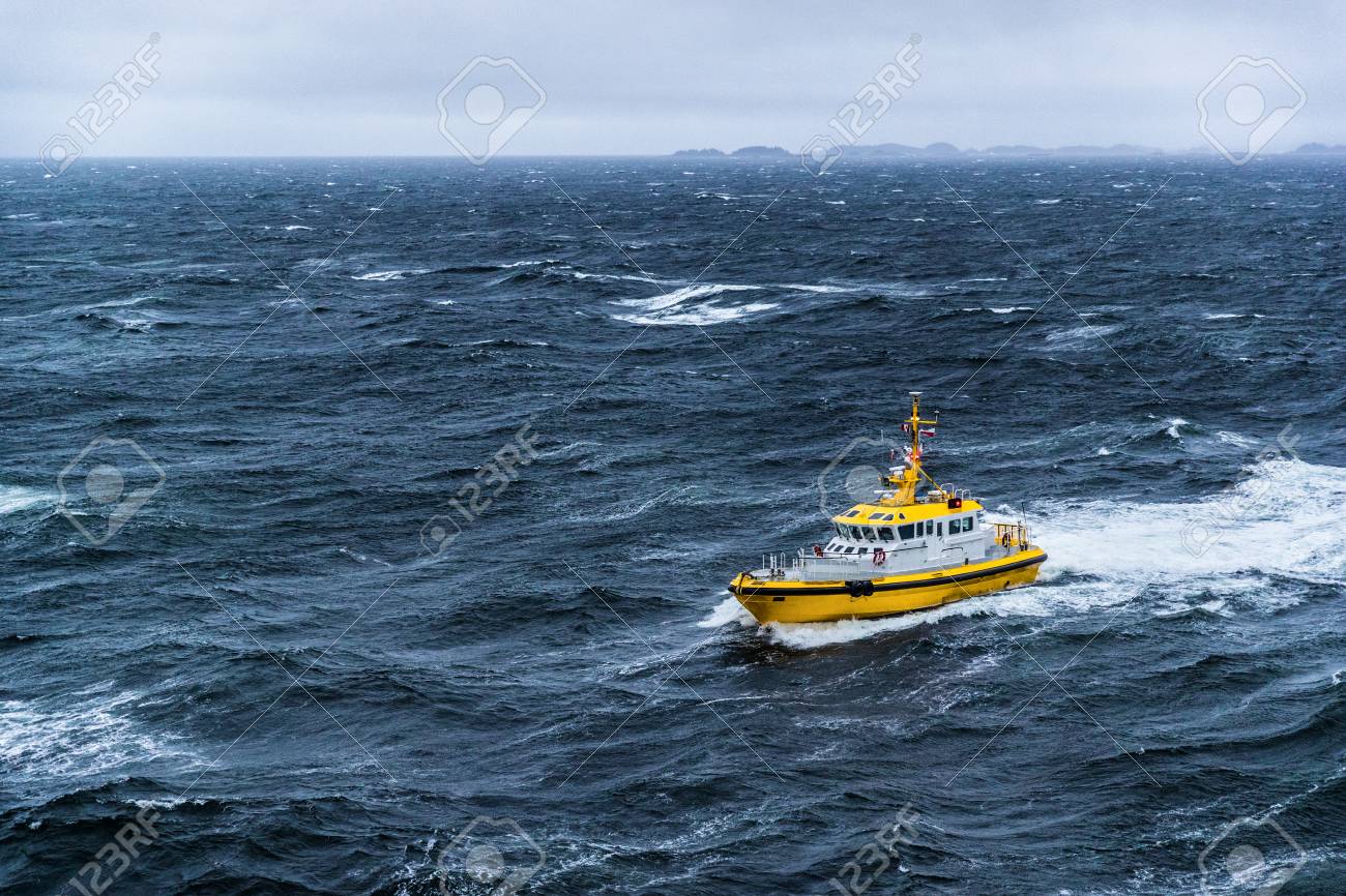Coast guard boat patrol riding on rough sea waves in Alaska. - 117197228 Coast guard boat patrol riding on rough sea waves in Alaska. - 117197228