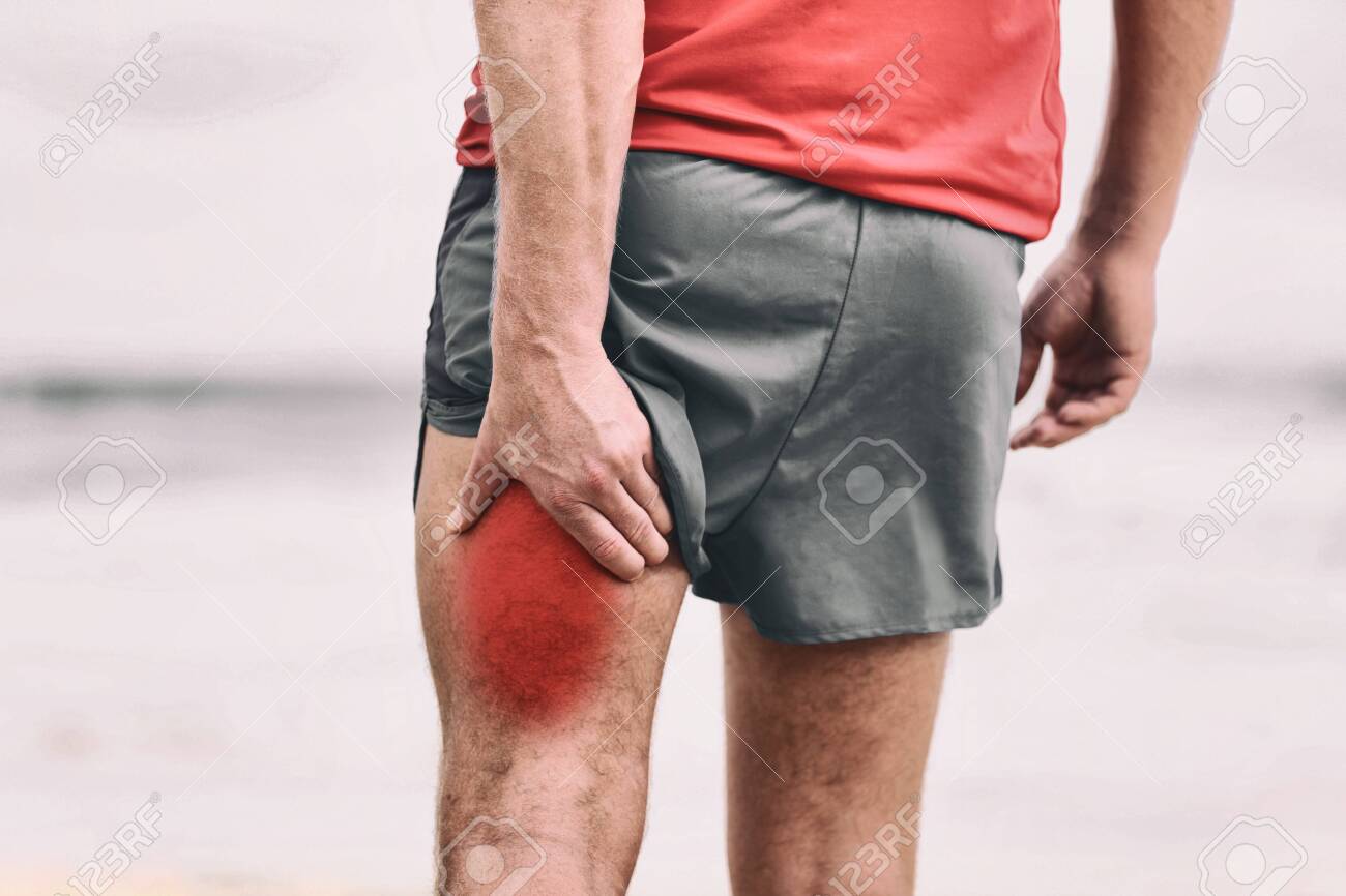 Hamstring pain pulled muscle on back thigh painful red area athlete man massaging sports injury fitness cramp muscles. - 127511585 Hamstring pain pulled muscle on back thigh painful red area athlete man massaging sports injury fitness cramp muscles. - 127511585