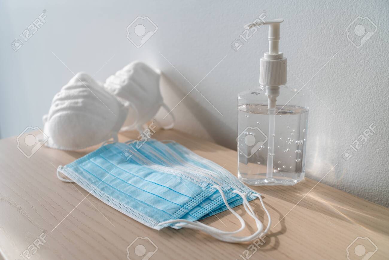 Coronavirus corona virus prevention travel surgical masks and hand sanitizer gel for hand hygiene spread protection. - 141627048 Coronavirus corona virus prevention travel surgical masks and hand sanitizer gel for hand hygiene spread protection. - 141627048
