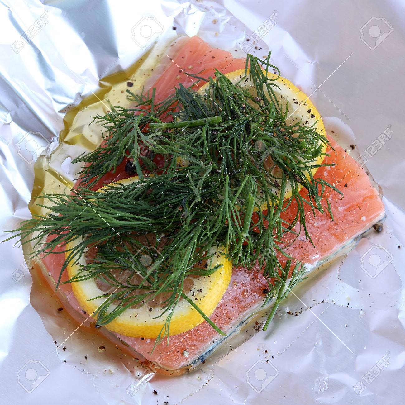 Raw Salmon With Dill And Lemon In Foil Ready To Be Cooked On Stock Photo Picture And Royalty Free Image Image 28093620
