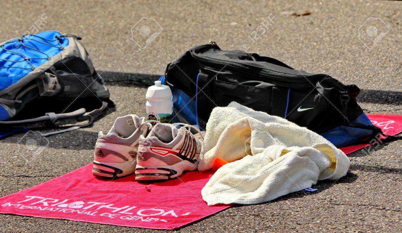 GENEVA, SWITZERLAND - JULY 24 : one unidentified male runner after the swimm race at the international Geneva Triathlon, on july 24, 2011 in Geneva, Switzerland - 10434157 GENEVA, SWITZERLAND - JULY 24 : one unidentified male runner after the swimm race at the international Geneva Triathlon, on july 24, 2011 in Geneva, Switzerland - 10434157