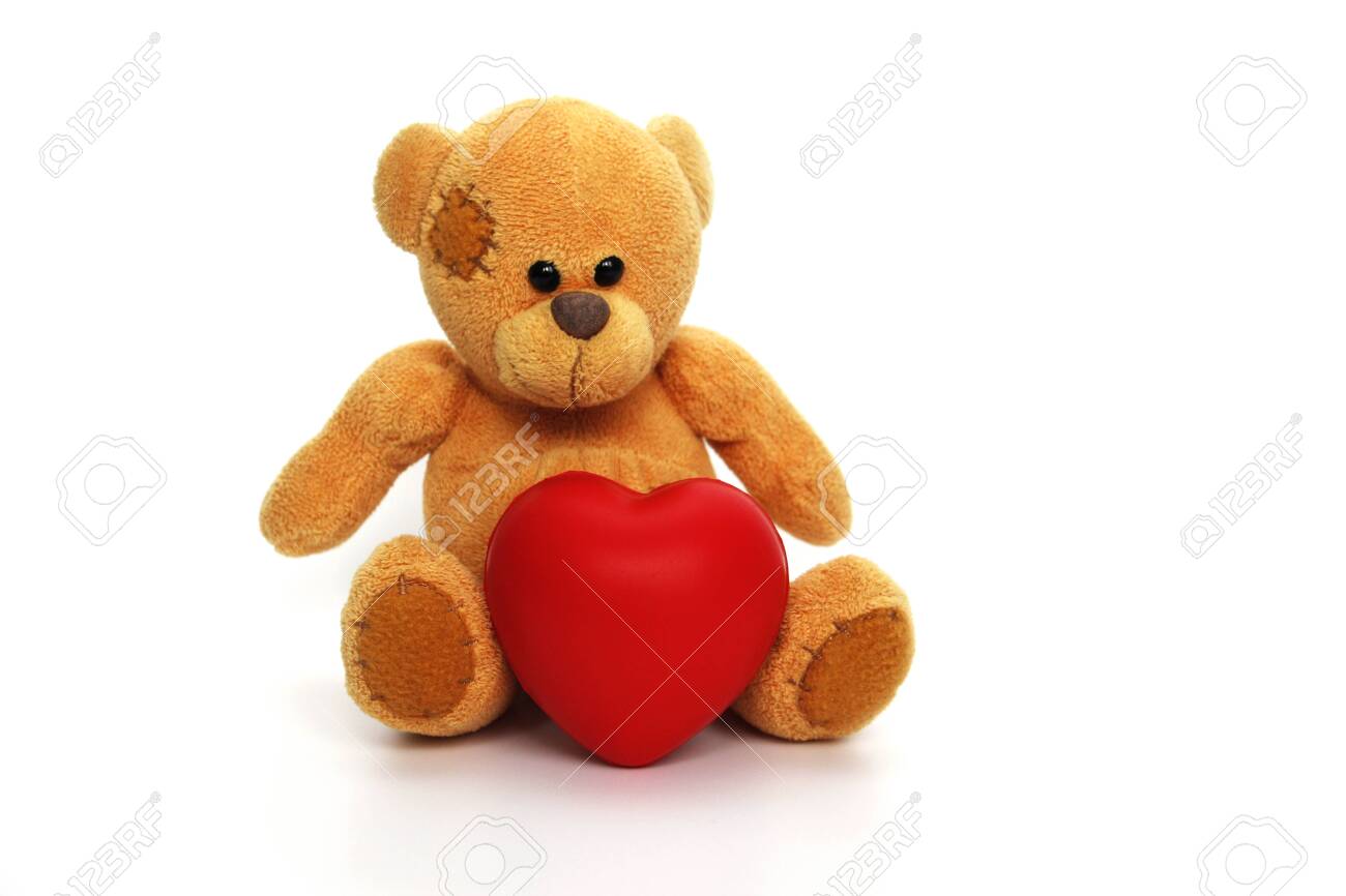white teddy bear with red heart