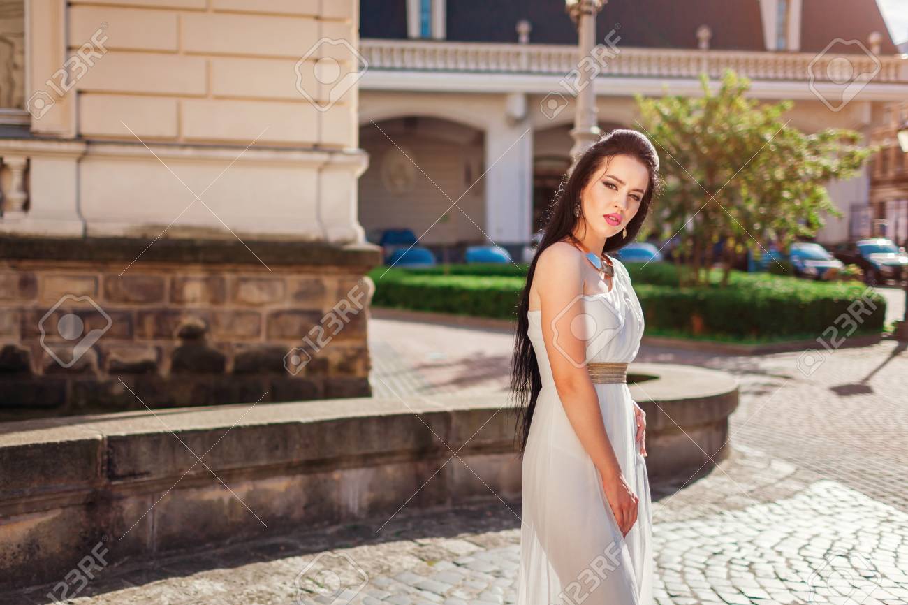 Beautiful Woman Wearing White Wedding Dress Outdoors In Old City