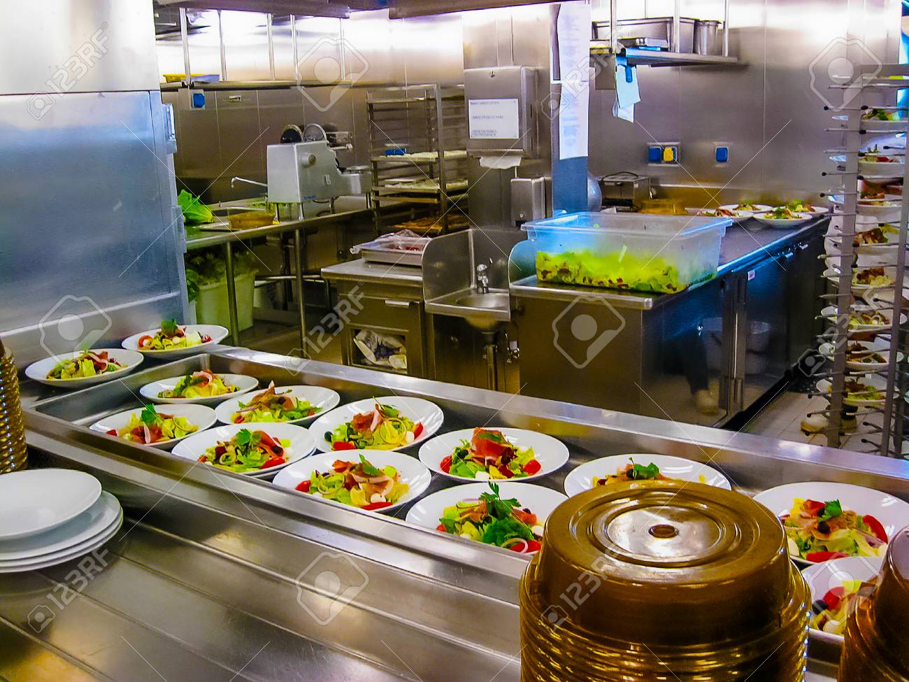 The Kitchen With Plates Ready For Serving Dinner On A Cruise