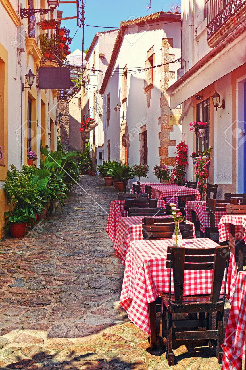 https://previews.123rf.com/images/marina99/marina991603/marina99160300097/53586786-view-of-outdoor-cafe-on-narrow-street-in-the-old-european-mediterranean-city-at-sunset.jpg