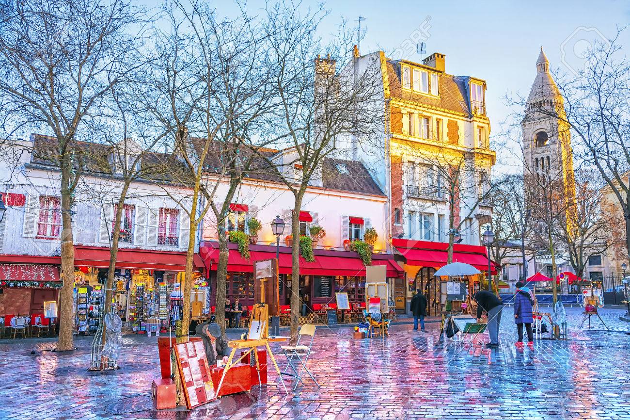 Place du Tertre in Montmartre in Paris. In area lot of souvenirs and handicrafts. In small houses are located cafes, restaurants and art galleries. - 86436442 Place du Tertre in Montmartre in Paris. In area lot of souvenirs and handicrafts. In small houses are located cafes, restaurants and art galleries. - 86436442