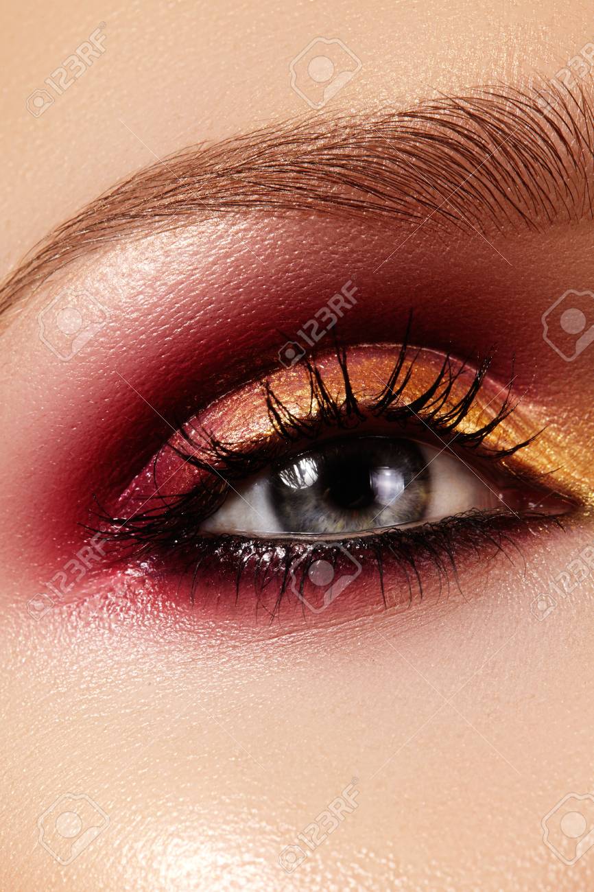 Closeup Female Eye With Fashion Bright Make-up. Beautiful Gold, Red  Eyeshadow, Wet Glitter, Black Eyeliner. Perfect Shape Of Eyebrows Stock  Photo, Picture and Royalty Free Image. Image 75971190., image size:866x1300