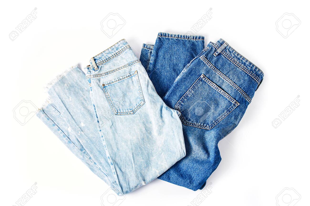 Two Folded Pairs Of Jeans In Light And Dark Blue On A White Background Stock Photo Picture And Royalty Free Image Image