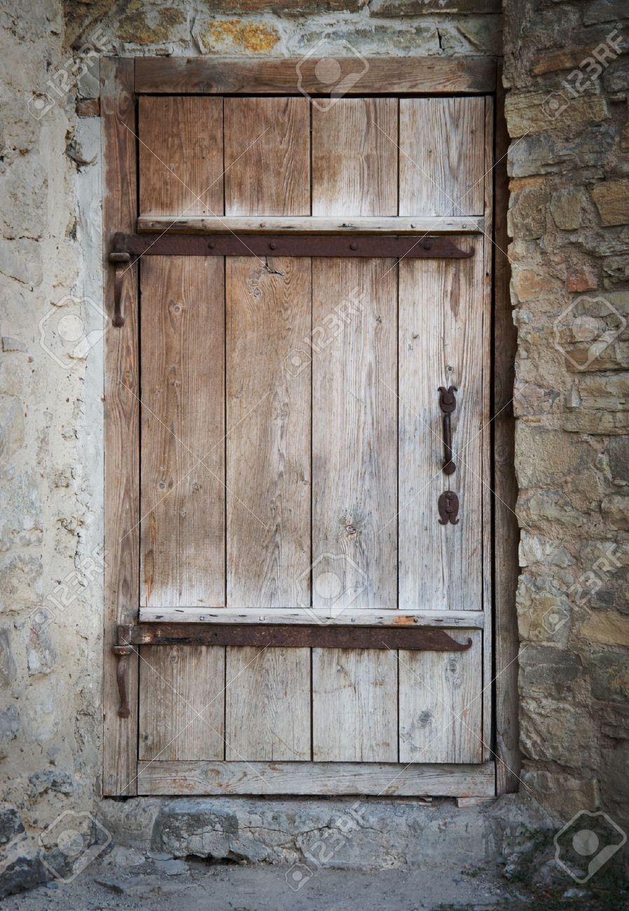 Old Wooden Door In A Stone Wall Stock Photo Picture And Royalty