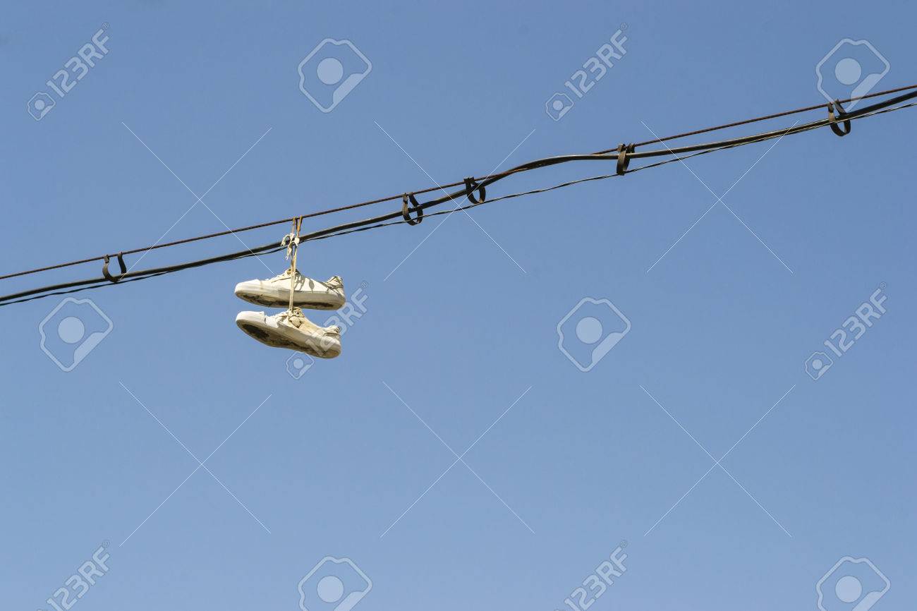 shoes thrown over telephone wires