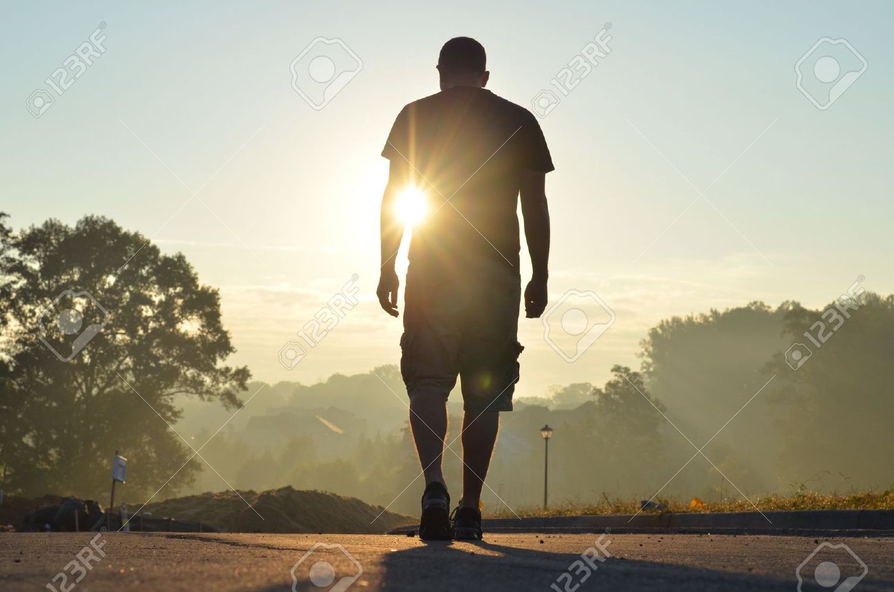 Man Walks Off Alone Facing An Unknown Future. Stock Photo, Picture and  Royalty Free Image. Image 24407164.