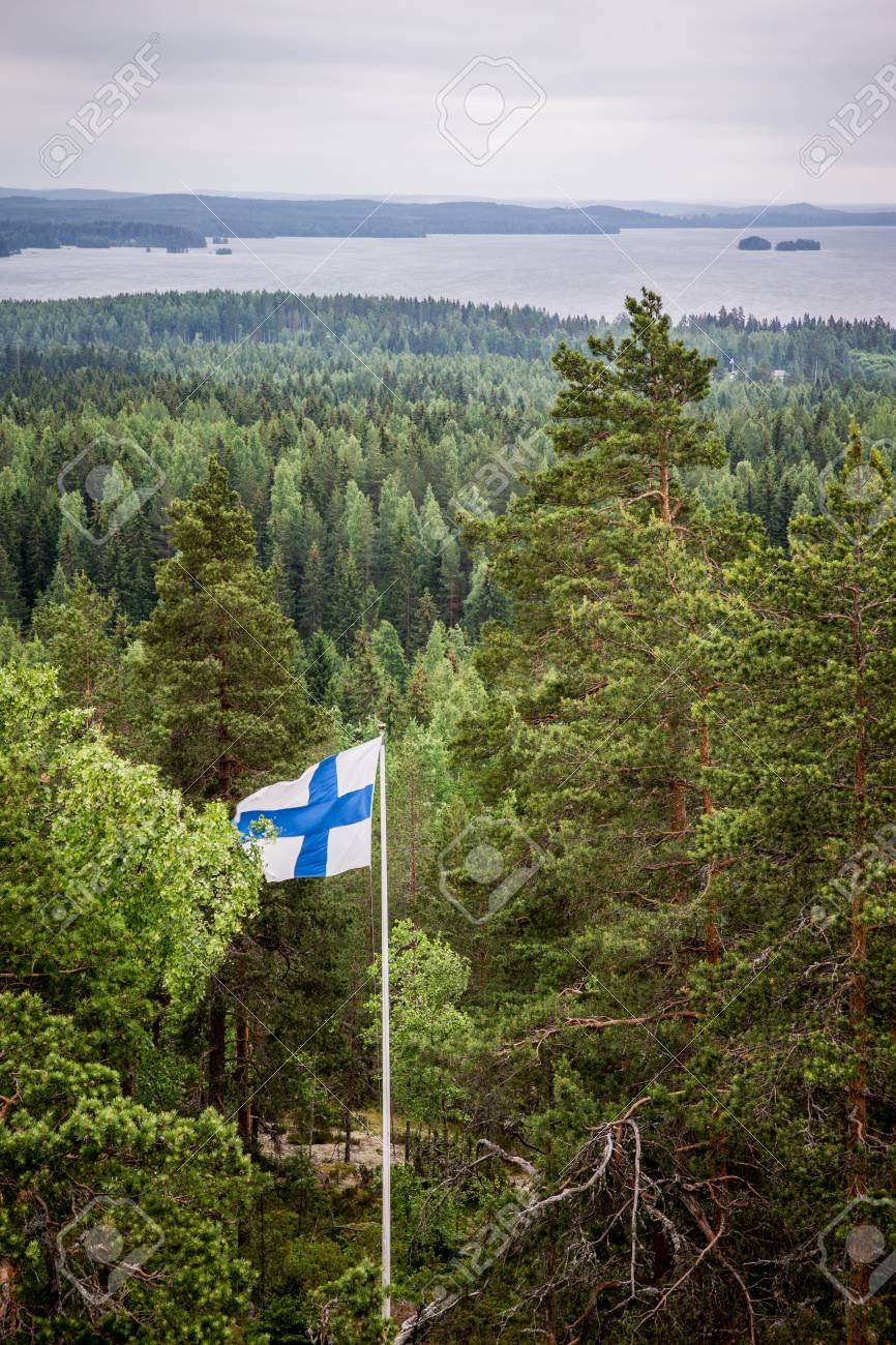 22567519-view-to-a-lake-surrounded-by-forest-with-the-finnish-flag.jpg