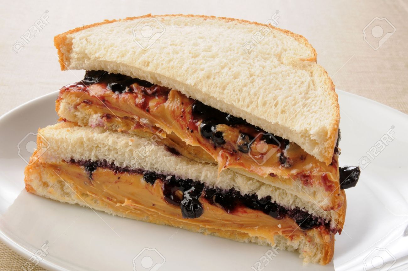 A Sliced Peanut Butter And Jelly Sandwich Stock Photo Picture And