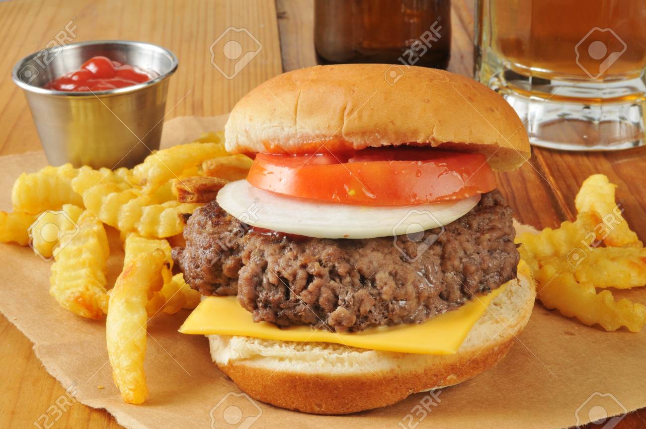 A Cheese Burger And French Fries With A Mug Of Beer Stock Photo Picture And Royalty Free Image Image 29610740