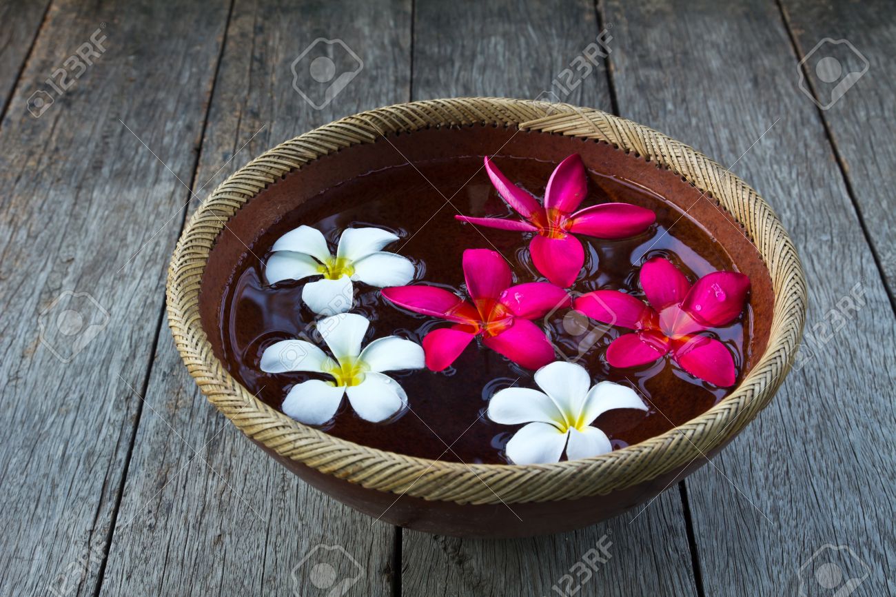 Plumeria Flower Floating In The Ancient Bowl Stock Photo Picture