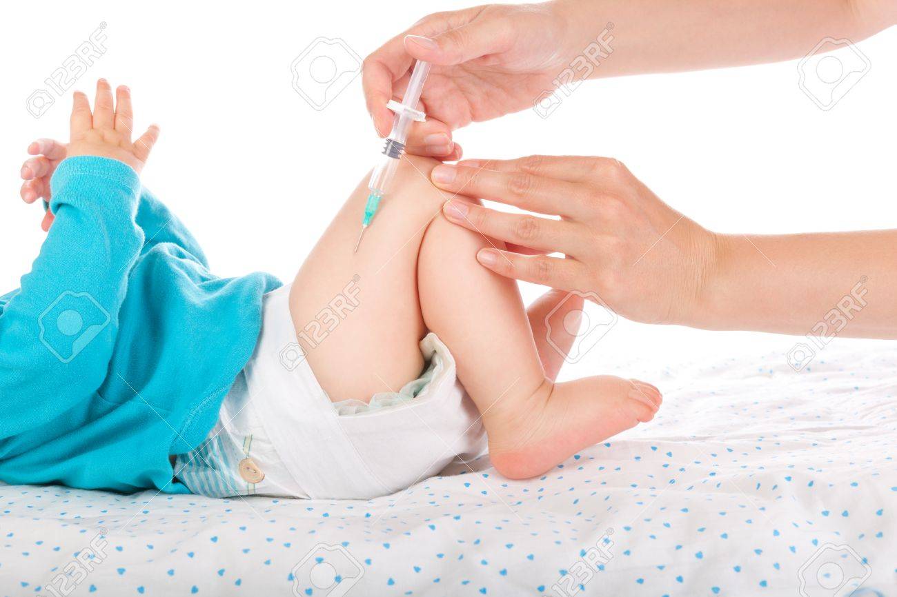 shot of pediatrician giving a three month baby intramuscular stock