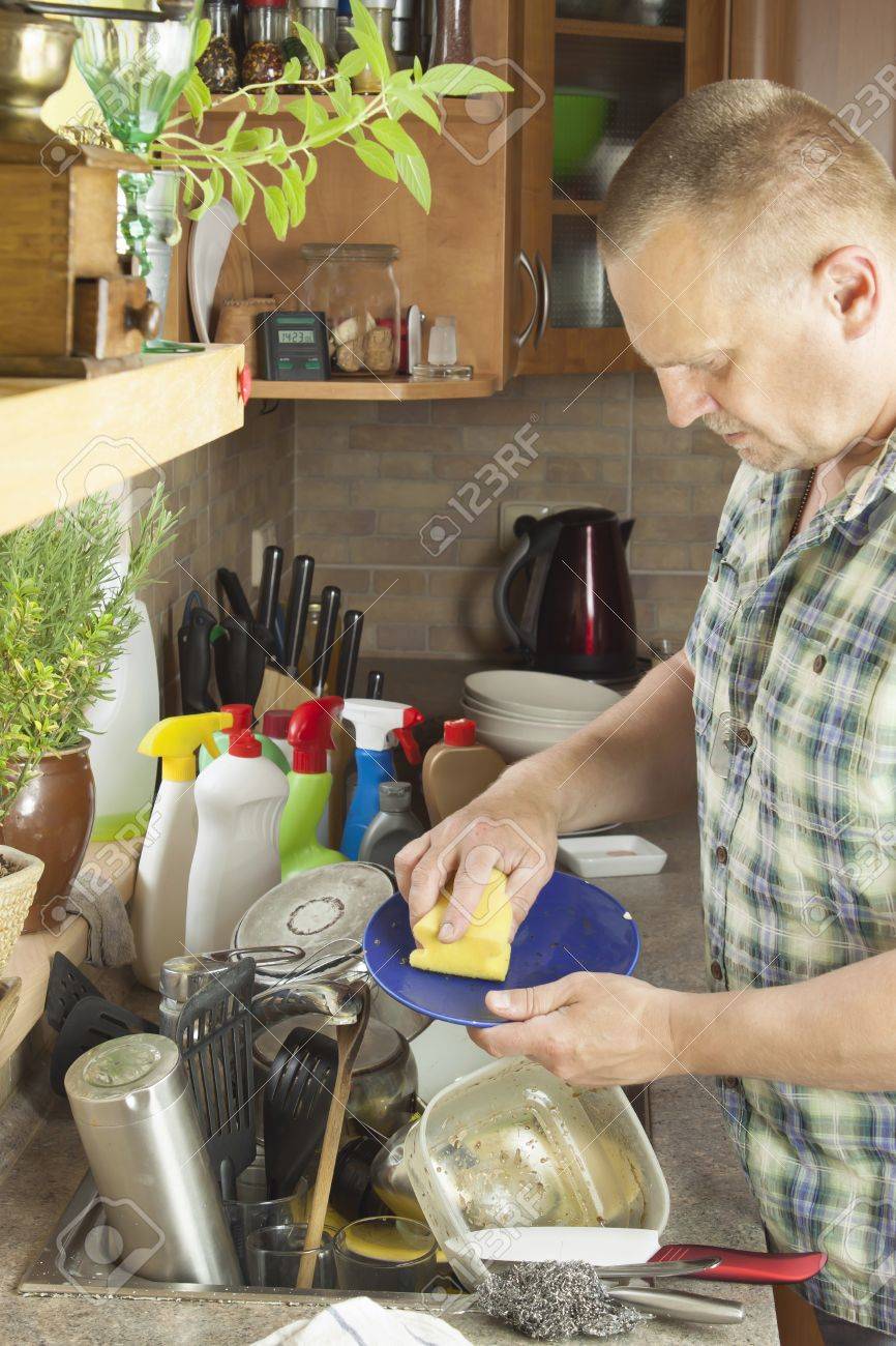 Kitchen Sink With Clean Dishes man washing dirty dishes in the kitchen sink. domestic cleaning Kitchen Sink With Clean Dishes man washing dirty dishes in the kitchen sink. domestic cleaning