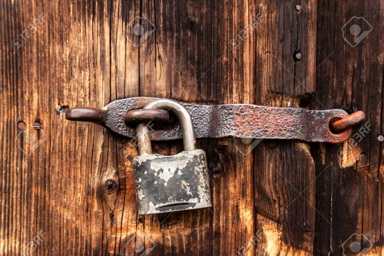 An Old Rusty Lock On A Wooden Door Protection Against Theft A Safe House Stock Photo Picture And Royalty Free Image Image 88831546