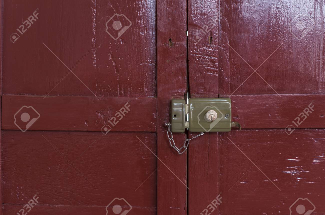 Old Lock Locked With Its Chain Seen From Inside An Old Door Painted ... Old Lock Locked With Its Chain Seen From Inside An Old Door Painted ...