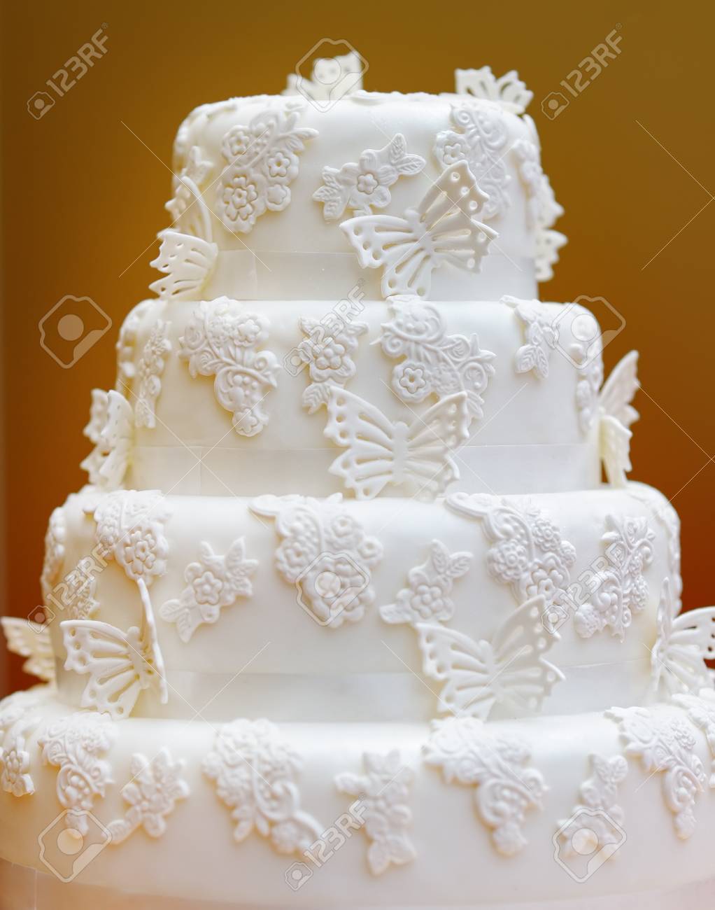 Delicious White Wedding Cake Decorated With Butterfly Stock Photo