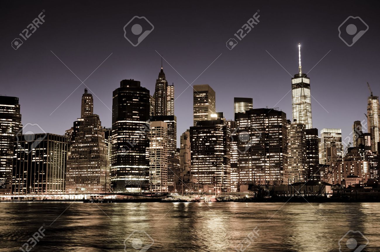 New York City Manhattan downtown skyline at night with illuminated skyscrapers, vintage filter - 41973599 New York City Manhattan downtown skyline at night with illuminated skyscrapers, vintage filter - 41973599