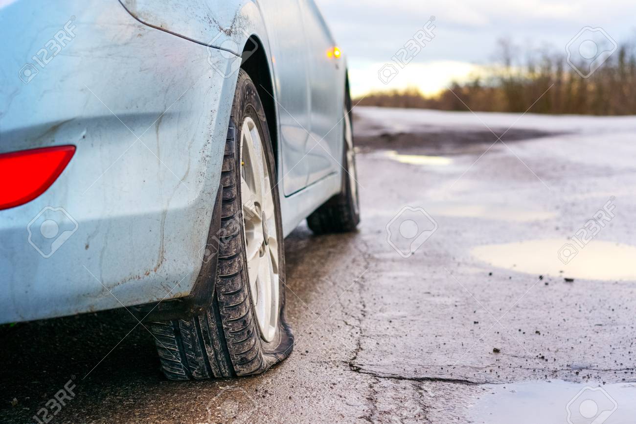 Nail In Tire Repair >> Flat Tire Of Blue Car On The Road Waiting For Repair Car Tire Nail In Tire Repair >> Flat Tire Of Blue Car On The Road Waiting For Repair Car Tire