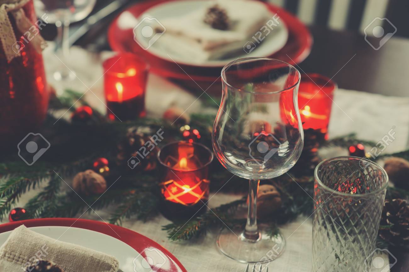 Table setting for celebration Christmas and New Year Holidays. Festive traditional red and green table at home with rustic details - 108364263 Table setting for celebration Christmas and New Year Holidays. Festive traditional red and green table at home with rustic details - 108364263