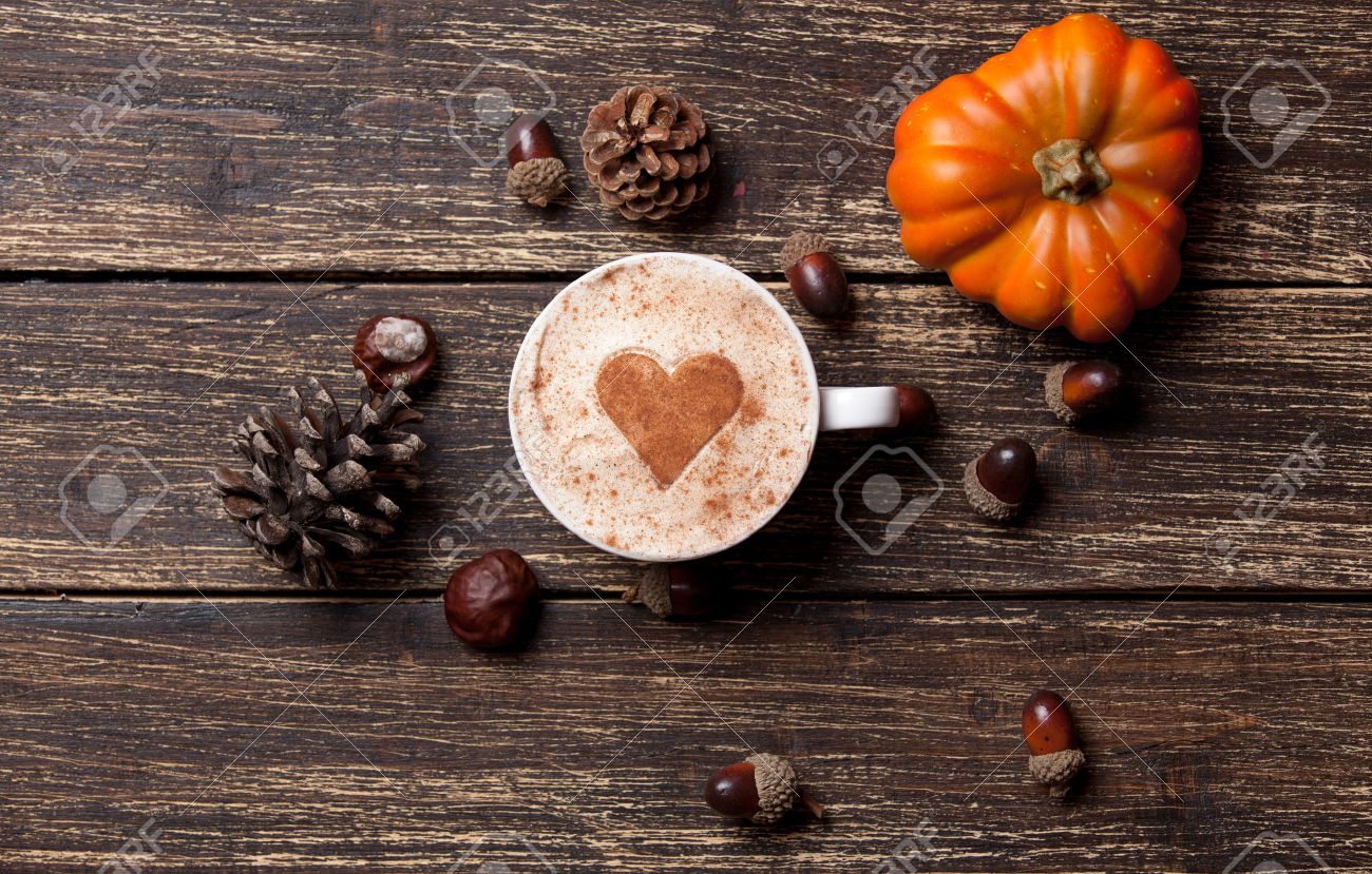 Cup of coffee with heart shape and pine cone with acorn and pumpkin on wooden background - 43008602 Cup of coffee with heart shape and pine cone with acorn and pumpkin on wooden background - 43008602